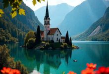 Lake Bled with island church and mountains in the background at sunrise