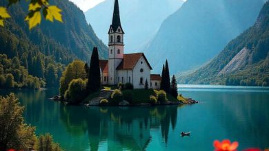 Lake Bled with island church and mountains in the background at sunrise