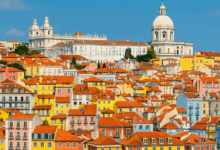 Colorful buildings and the Tagus River in Lisbon, Portugal – Travel Guide