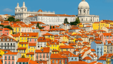 Colorful buildings and the Tagus River in Lisbon, Portugal – Travel Guide