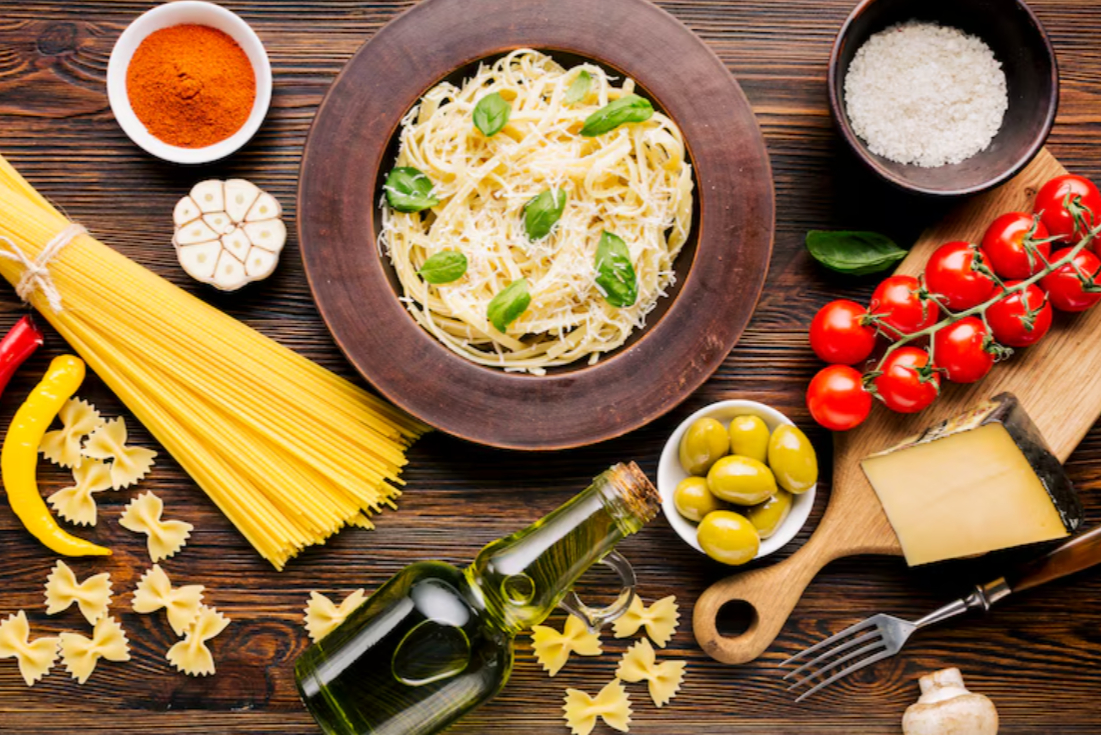 Table filled with traditional Italian dishes like pasta, bruschetta