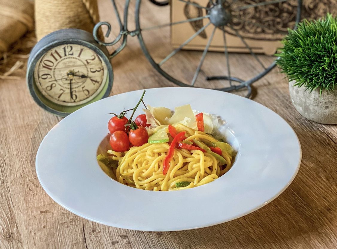 Authentic homemade Italian pasta with tomato and basil.