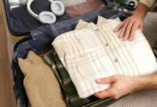 Organized suitcase showing minimalist travel packing tips