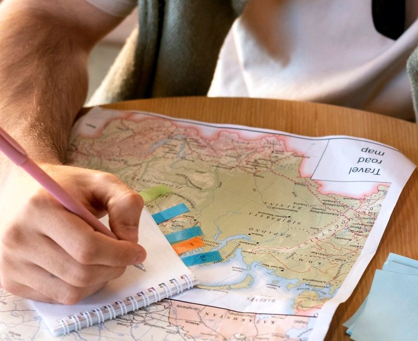 Solo traveler reading a map in a foreign city