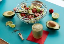 Easy vegan meal prep for travelers with fresh vegetables and grains.